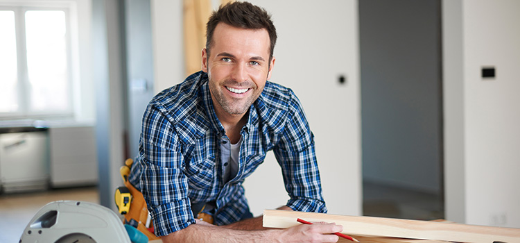 Photo of a contractor smiling at camera.